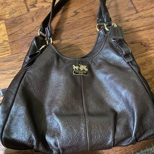 Brown Coach bag.